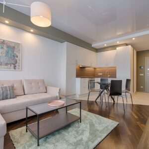 A living room connected to a kitchen